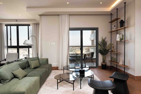 Comfort Apartment, City View | Desk, laptop workspace, iron/ironing board