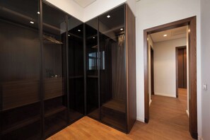 Luxury Apartment, City View | Desk, laptop workspace, iron/ironing board