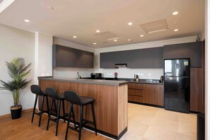 Economy Apartment, City View | Private kitchen | Fridge, microwave, oven, stovetop