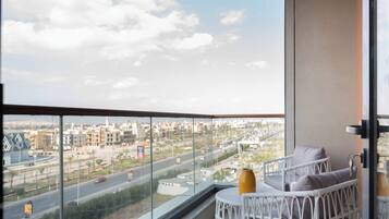 Luxury Apartment, City View | Living area | 64-inch Smart TV with satellite channels