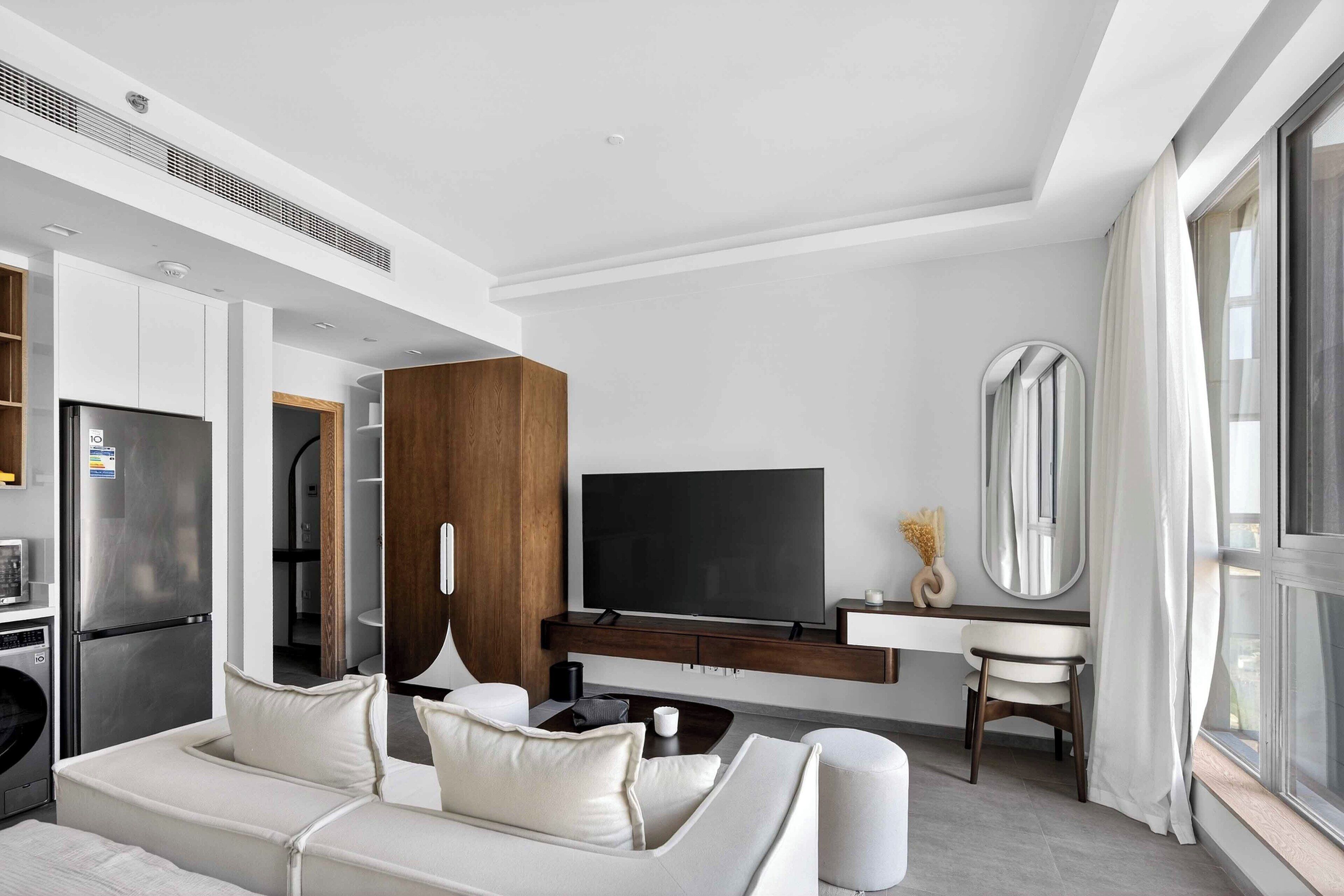 Luxury Suite | Living area | 64-inch Smart TV with satellite channels