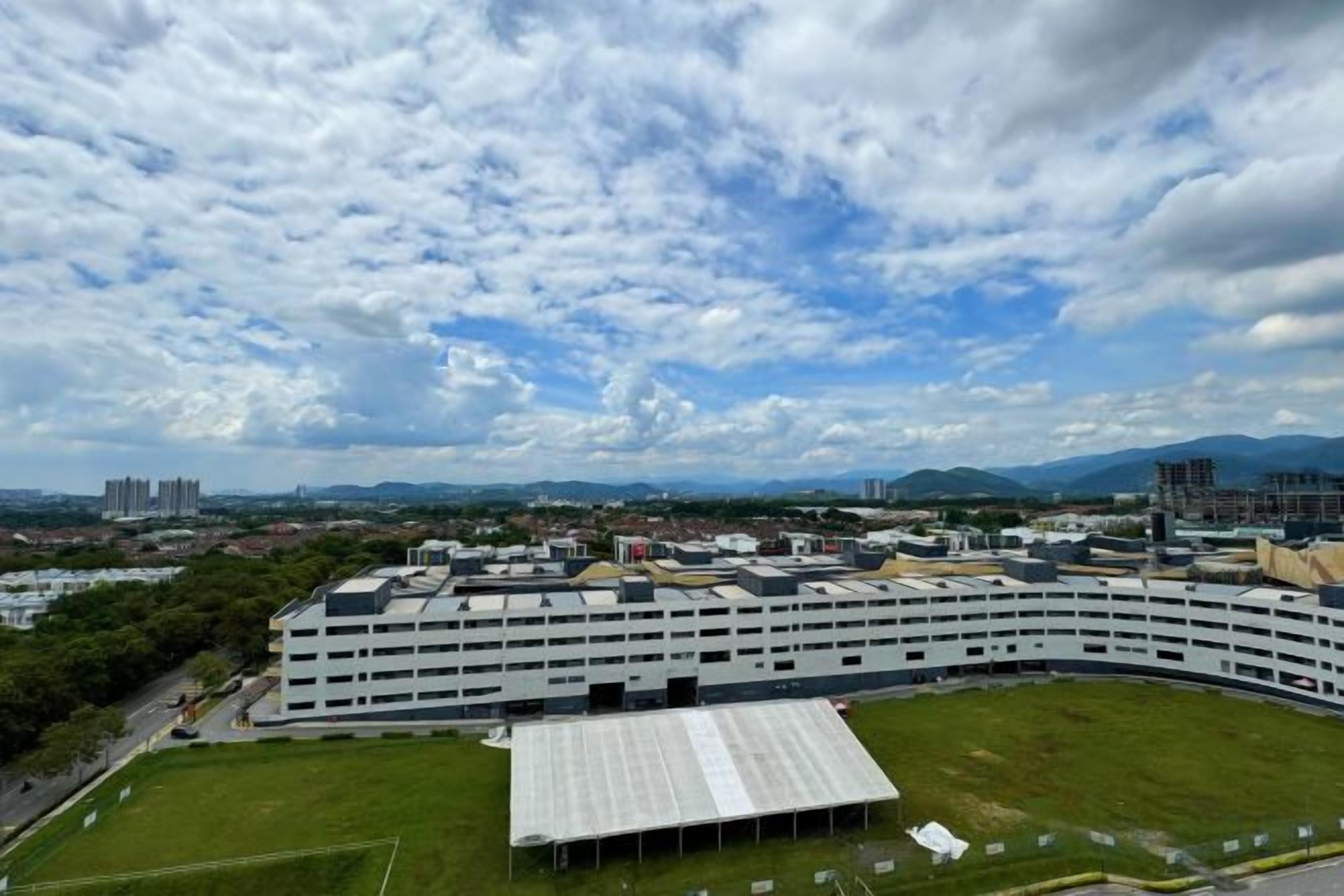 A multi-story parking garage with a flat roof structure.