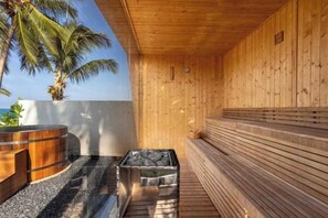 A wooden sauna with a stone bench and a hot tub. - Sava Villa 2 Villa Amarelo (Takua Thung)