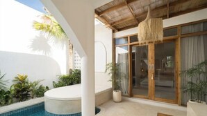 A modern outdoor pool area with a hot tub, surrounded by potted plants and a wooden pergola. - Brand New Villa 2Br with Private Pool Near Seminyak by BaliSuperHost (Bali)