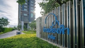 A modern building with a sign that reads 'INTERNATIONAL HOTEL' in blue letters.