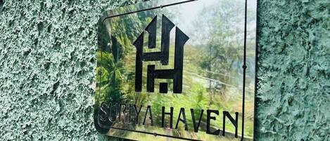 A sign with the text "SHRIYA HAVEN" on a textured wall.