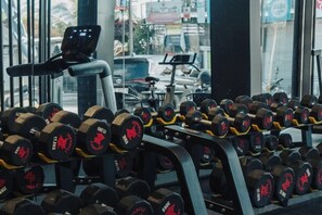 A gym with a variety of dumbbells arranged on racks. - Khaya Luxury Villas (Bali)