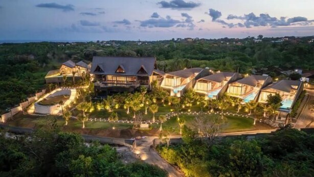 A resort with multiple bungalow-style buildings, a central pool, and a well-maintained garden area. - Khaya Luxury Villas (Bali)