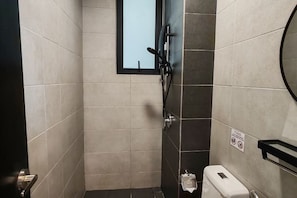 A small, modern bathroom with a window, a towel dispenser, and a toilet paper roll. - Skyblue 2 Rooms Apartment, 4+2 Pax @ Urban Suites (George Town)