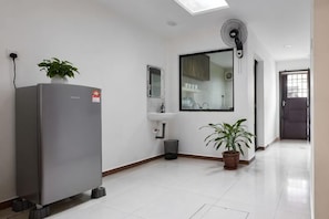 A modern kitchen with a refrigerator, sink, and potted plants. - IpohComfortHomestay, 4-10pax 10mins to attraction (Ipoh)