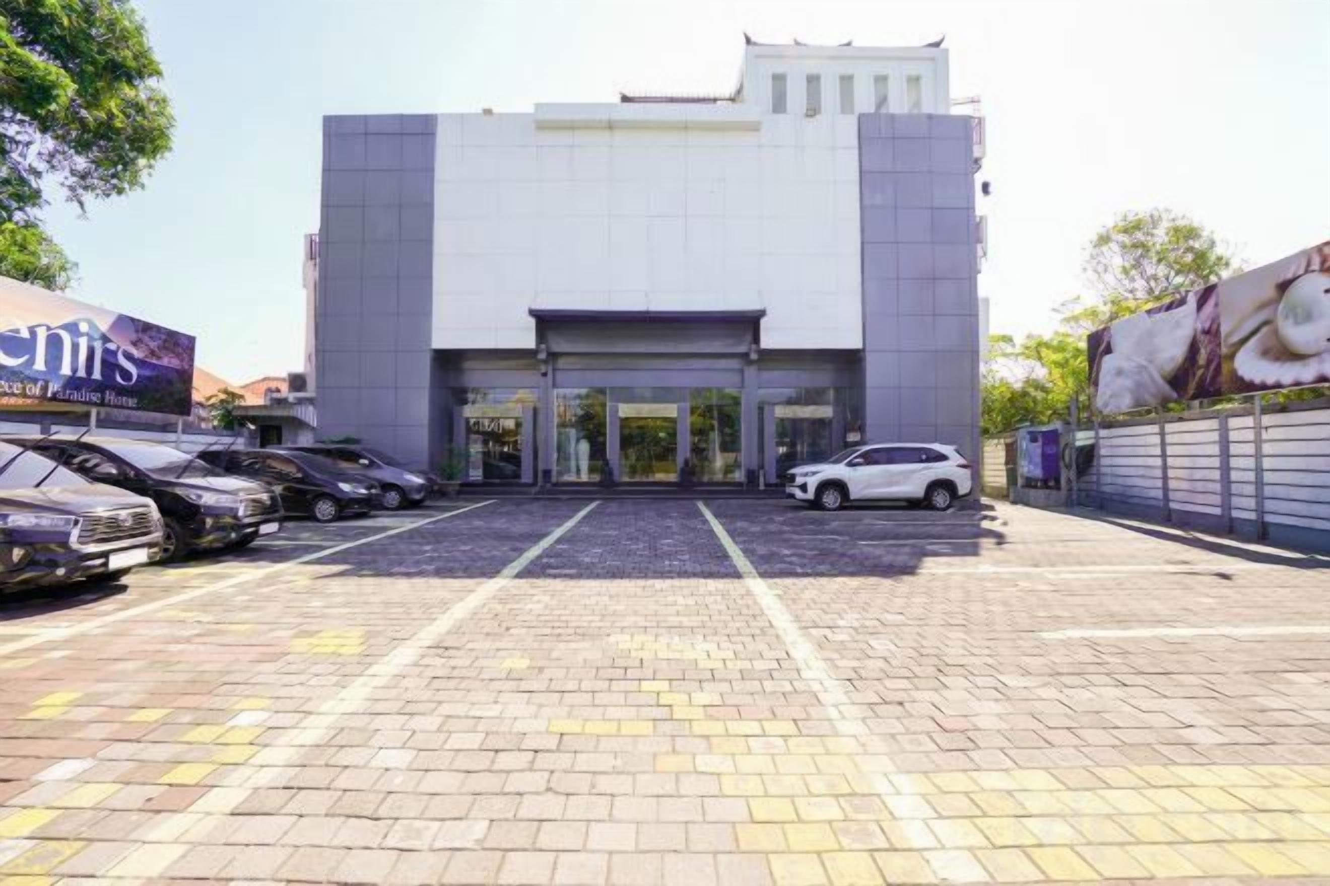 A building with a parking lot and a gated entrance.