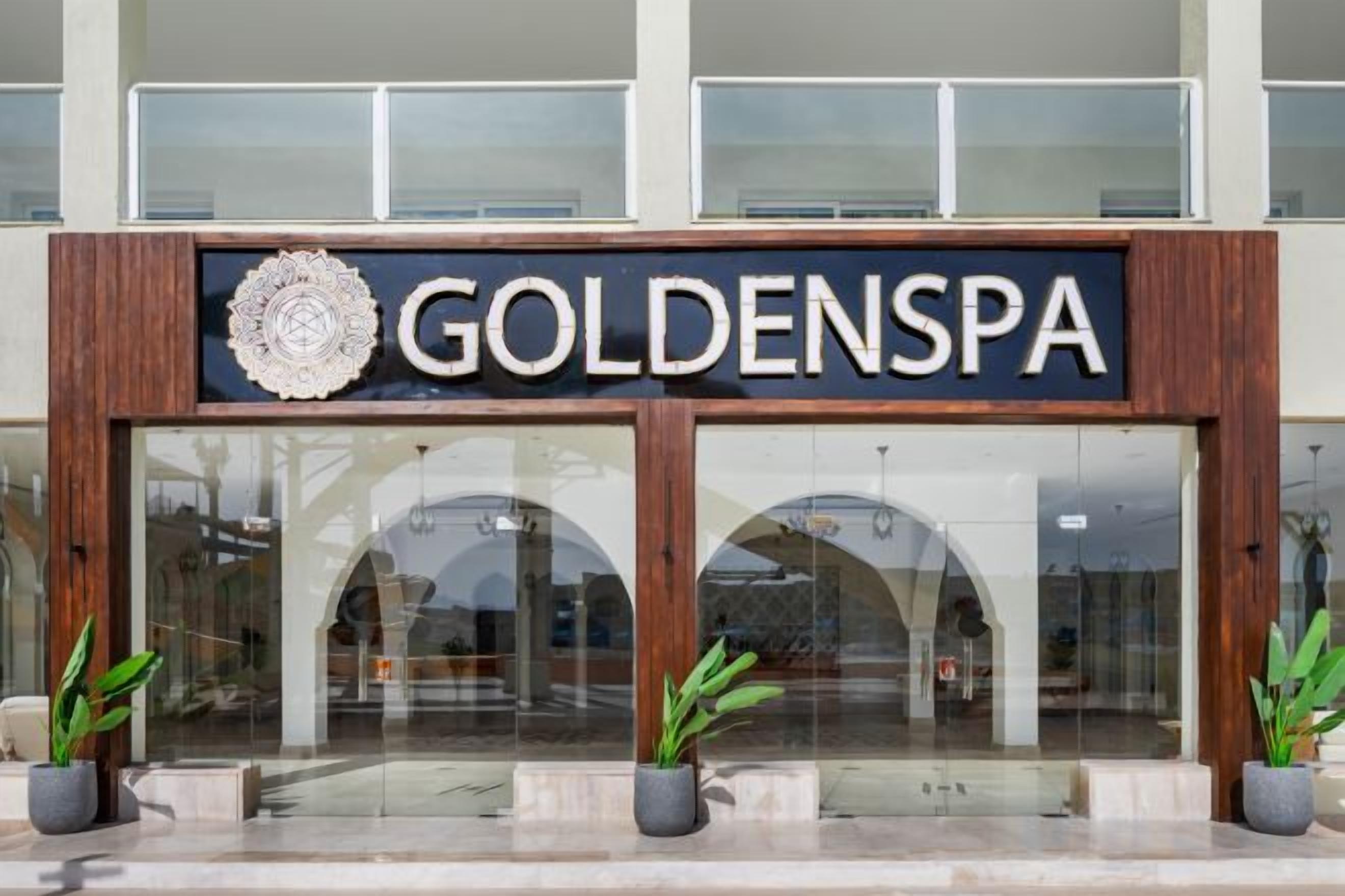 A building with a sign that reads 'GOLDENSPA'.
