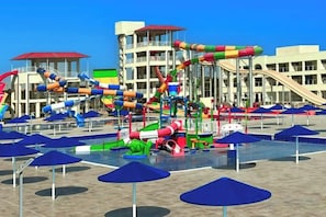 A water park with multiple slides and pools, surrounded by umbrellas and buildings. - Albatros Makadi Resort - 24 HRS All Inclusive (Hurghada)
