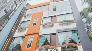 A multi-story building with a sign indicating it is the Rachna Tourist Lodge. - Hotel Rachna Tourist lodge  (New Delhi)