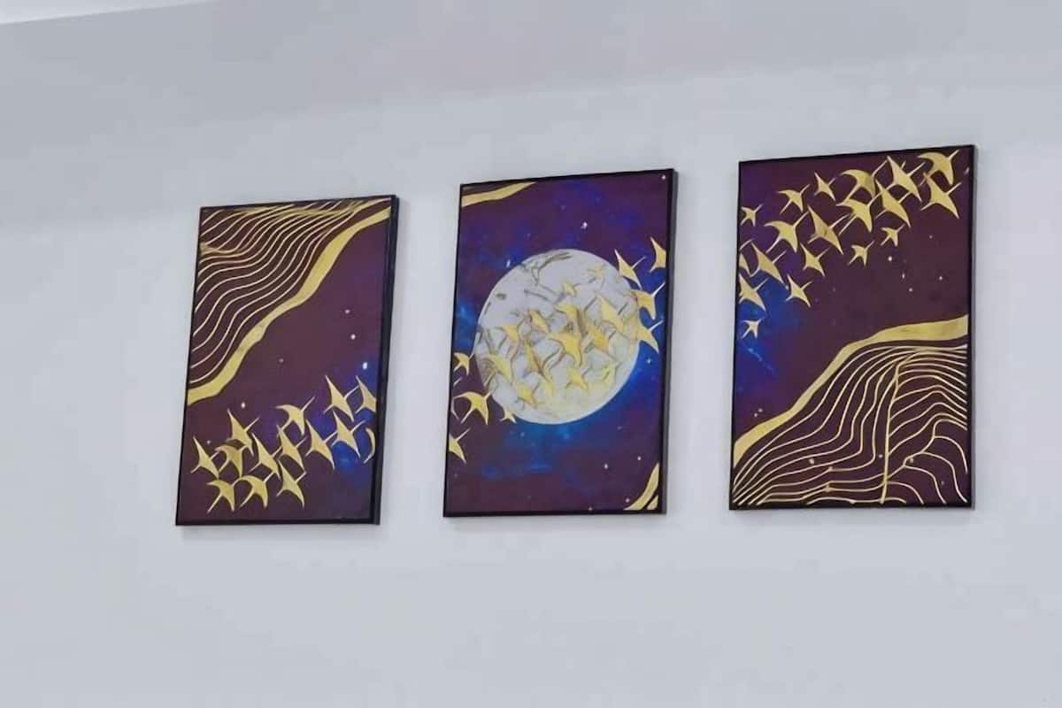Three wall-mounted artworks depicting abstract designs with patterns and shapes.
