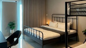 A bunk bed room with a desk, chair, and a potted plant. - Private & Cozy house, Chiang Rai Airport (Chiang Rai)