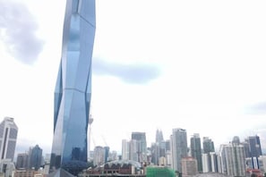 Unclassified image, 5 of 26, button - 8Pax/Green View next to KL118 ChinaTown & Train (Kuala Lumpur)
