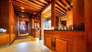 A wooden interior with a hallway leading to a reception area. - Boutique 5 Bedroom Seaview Pool Villa Kata Beach Phuket Warm Plus (Phuket)
