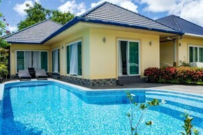 A two-story house with a swimming pool, large windows, and a tiled roof. - Villa Tanya @ Platinum 3br Private Pool & Jacuzzi (Phuket)