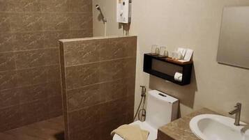 Family Room, Balcony, Courtyard View | Bathroom | Combined shower/tub, free toiletries, hair dryer, towels