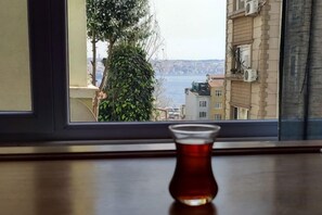 A view through a window with a table in the foreground.