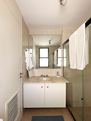 Shower, hair dryer, towels, toilet paper