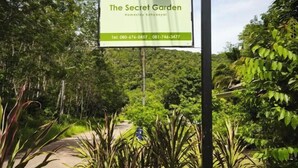 A sign for "The Secret Garden" with contact numbers. - The Secret Garden Homestay Koh yao yai (Koh Yao Yai)