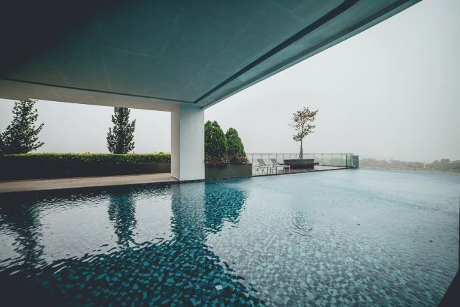 A modern infinity pool with a clear view of the horizon.