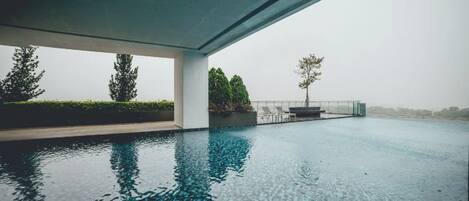 A modern infinity pool with a clear view of the horizon.