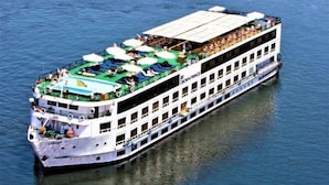 A large riverboat with multiple decks, outdoor seating areas, and a covered upper deck. - Jaz Crown Prince Nile Cruise - Every Monday from Luxor for 07 & 04 Nights (At Tod)