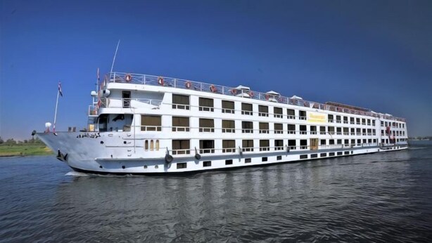 A large riverboat with multiple decks, a flag at the bow, and a clear sky. - JAZ Crown Emperor - Every Thursday from Luxor for 07 & 04 Nights (At Tod)