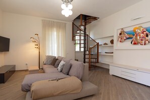 Apartment, 3 Bedrooms, Garden Area | Living area | 30-inch TV with satellite channels