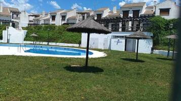 Seasonal outdoor pool, open 11:00 AM to 9:00 PM, pool umbrellas