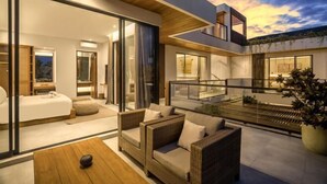 A modern house with a spacious living area, a balcony, and a large window overlooking the interior. - Swastamita (Bali)