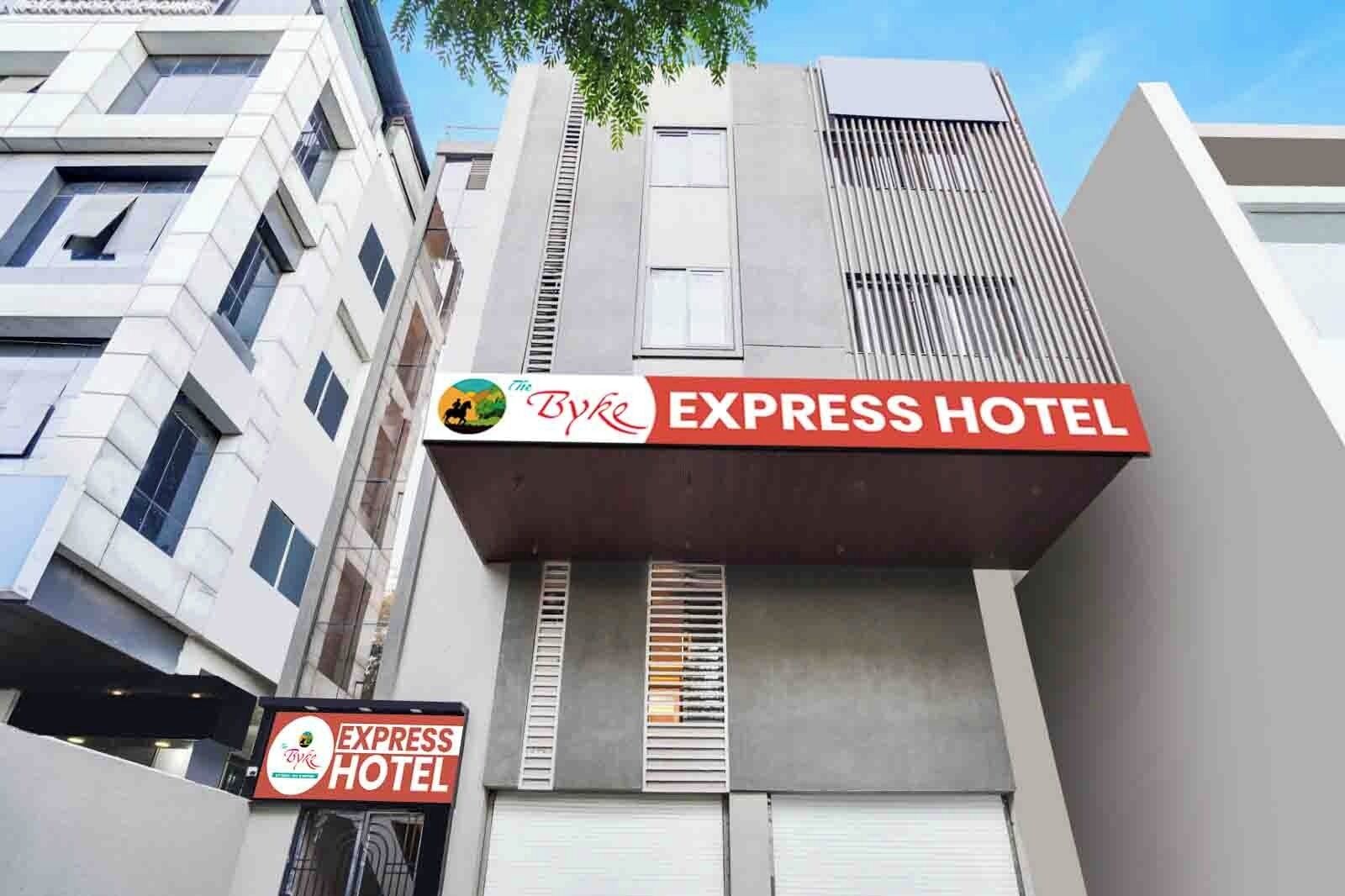 The exterior of the Express Hotel with a prominent signboard.