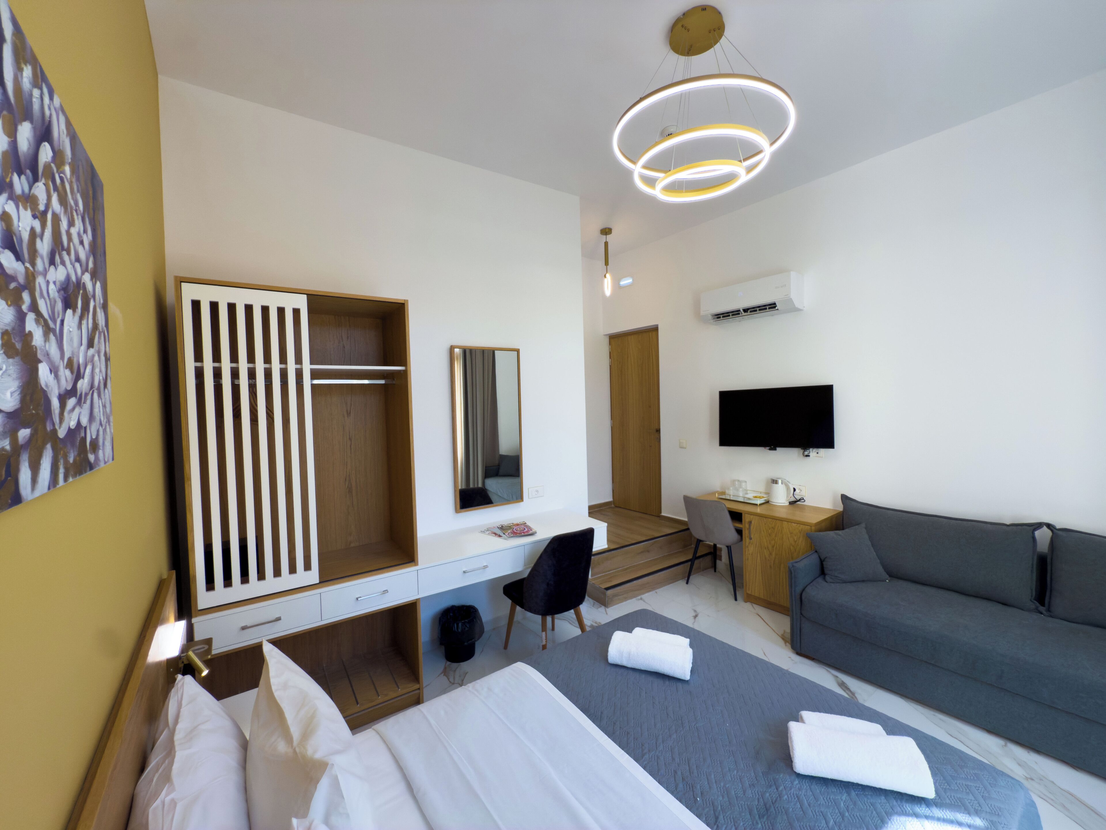 Standard Triple Room, Balcony, City View | In-room safe, blackout drapes, soundproofing, iron/ironing board