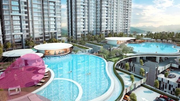 A high-rise residential building with multiple swimming pools, balconies, and a landscaped area. - Putrajaya Dwiputra 6 Plus 1 PAX Fully Air-Con (Putrajaya)
