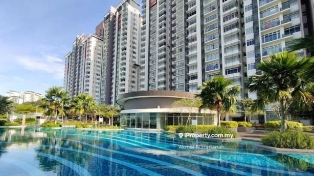 A high-rise residential building with a swimming pool in front. - Putrajaya Dwiputra 6 Plus 1 PAX Fully Air-Con (Putrajaya)