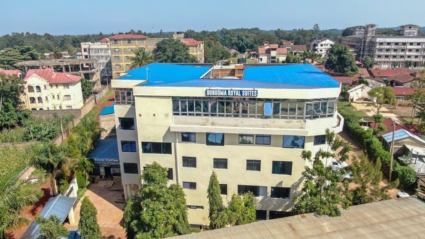 A building with a sign reading "Bungoma Royal Suites."