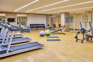 A gym with treadmills, exercise balls, and weight machines. - MCollection - Scenic Tagaytay Getaway with Taal Views (Batangas)