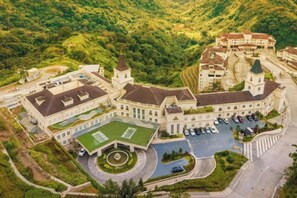 A large, historic building with multiple wings and a central courtyard. - MCollection - Scenic Tagaytay Getaway with Taal Views (Batangas)