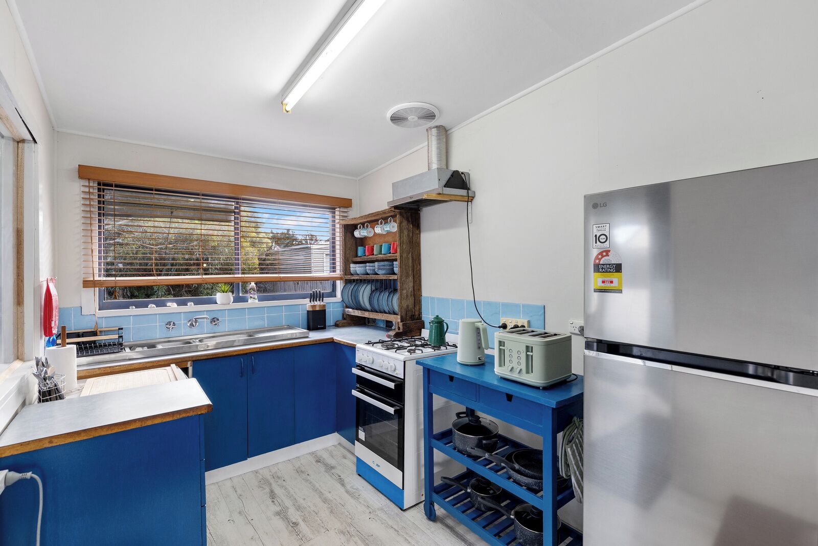 Fridge, microwave, toaster, cookware/dishes/utensils