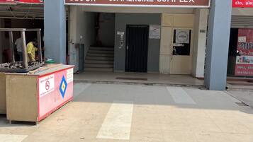 A commercial complex entrance with a sign for Swagat Rain Forest-1 Block.
