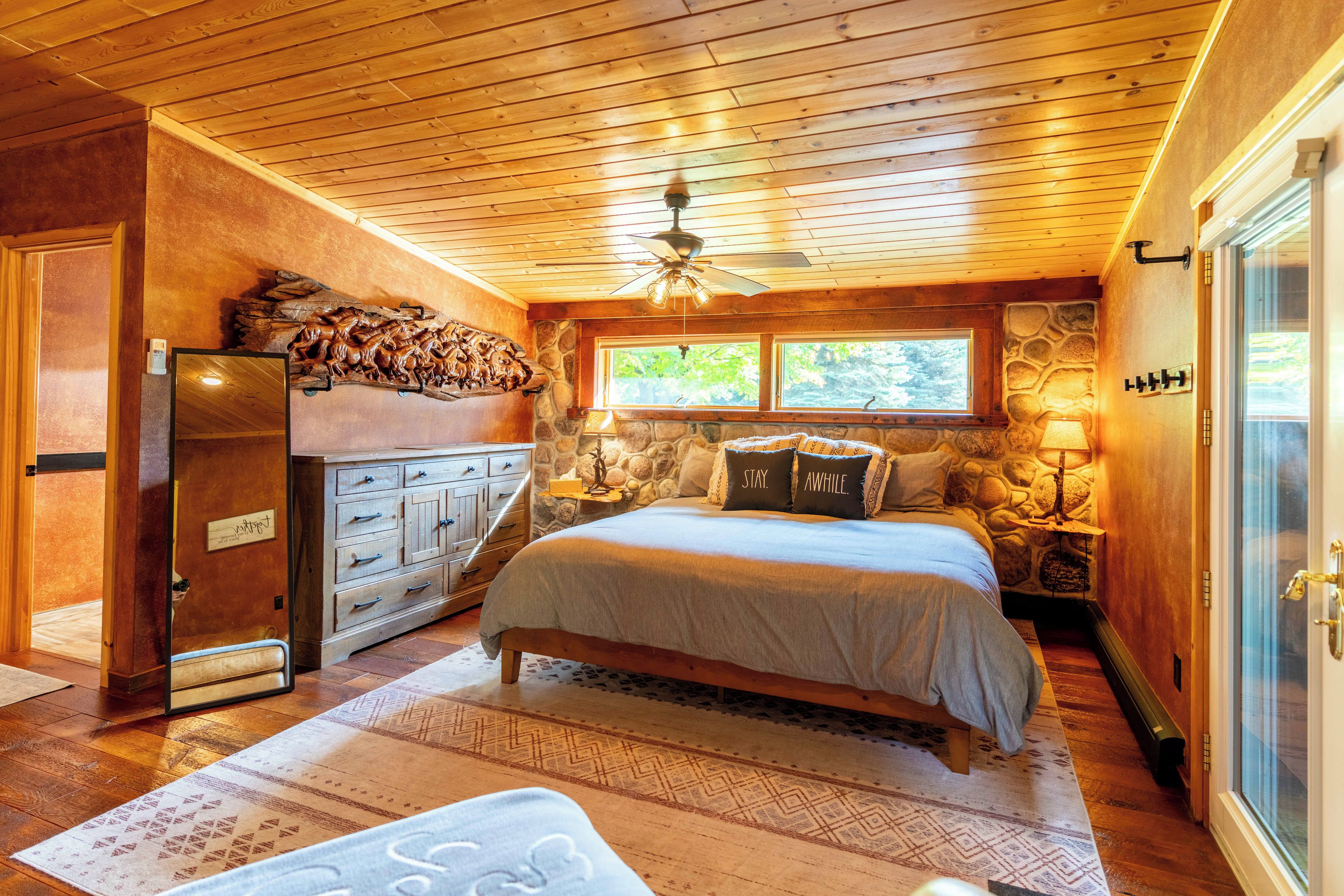 Master bedroom with attached full bathroom and walkout patio