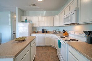 Fridge, microwave, stovetop, coffee/tea maker