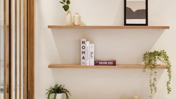 A minimalist shelf with books, a framed picture, and decorative items. - AIRI Home,3BR near Thapae and walking str old town CNX (Chiang Mai)