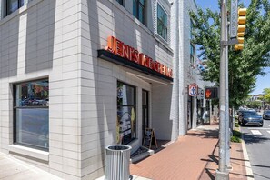 A building with a sign reading "JEN'S ICE CREAMS" on the facade.