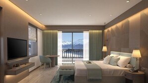 A modern hotel room with a large bed, a TV, a balcony with a mountain view, and a seating area with a table and chairs. - dusitD2 Fagu (Shimla)