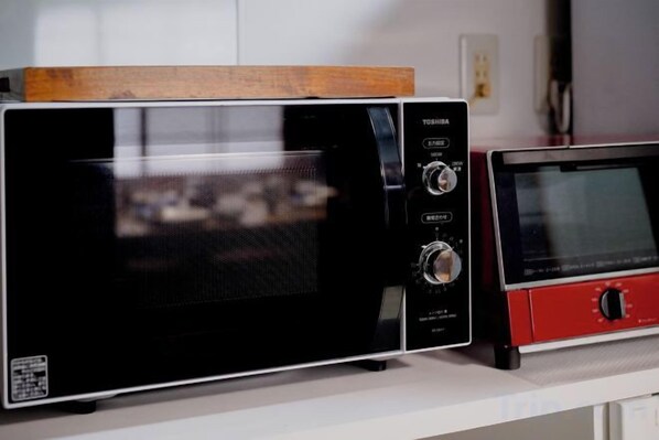 Two microwave ovens on a kitchen counter. - Gion Donguri An (Kyoto)