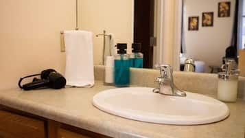 Shower, hair dryer, towels, shampoo